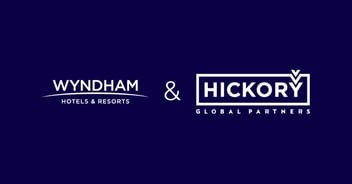 Wyndham Hotels & Resorts and Hickory Global Partners company logos displayed on dark purple background.